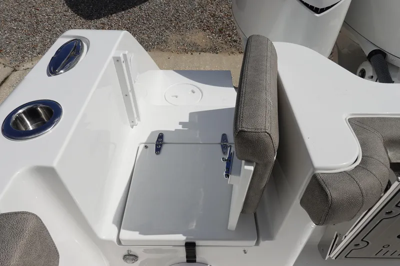 Slide: The Image of 2026 Sea Hunt Gamefish 30 Coffin Box boat seating area with cup holders. - 13