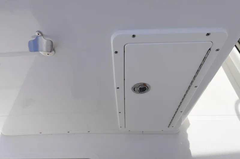 Slide: The Image of 2026 Sea Hunt Gamefish 30 Coffin Box hatch detail, featuring sleek design and secure latch. - 20