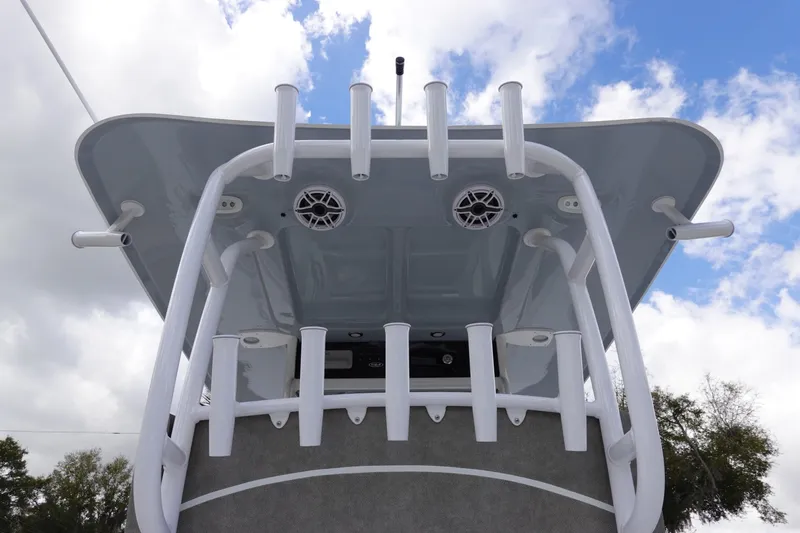 Slide: The Image of 2026 Sea Hunt Gamefish 30 Coffin Box boat, view of T-top and rod holders. - 23