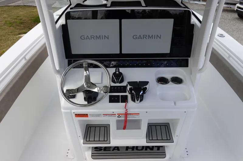 Slide: The Image of 2026 Sea Hunt Gamefish 30 Coffin Box helm with dual Garmin displays and controls. - 26