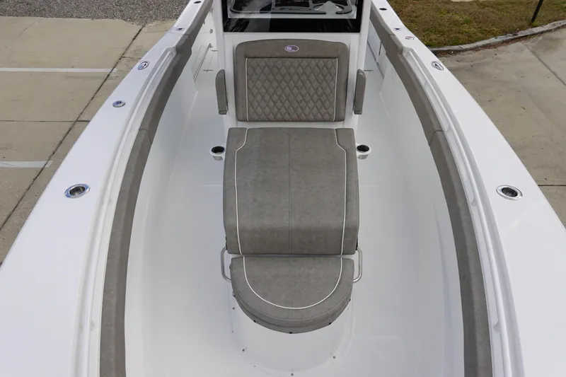 Slide: The Image of 2026 Sea Hunt Gamefish 30 Coffin Box boat interior with cushioned seating. - 32