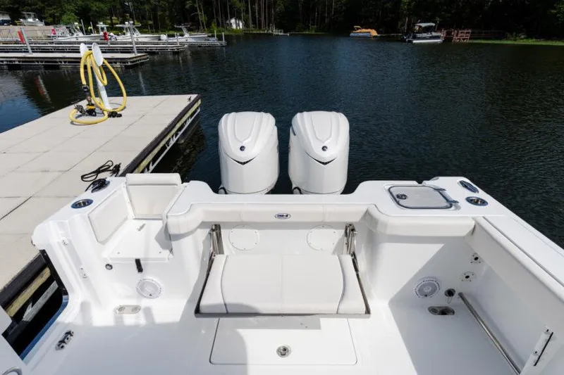 Slide: The Image of 2026 Sea Hunt Gamefish 30 Coffin Box boat with dual Yamaha engines, featuring spacious seating. - 8