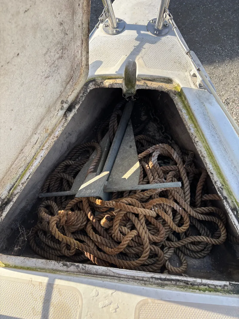 Slide: The Image of Anchor locker of a 1986 Catalina 25 with ropes and anchor. - 15