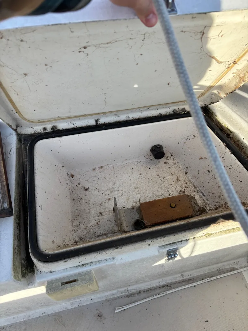 Slide: The Image of Open storage compartment on a 1986 Catalina 25 boat. - 35
