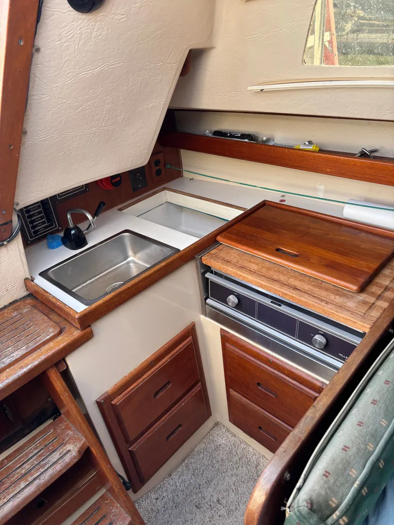 Slide: The Image of 1986 Catalina 25 galley with sink and stove. - 47