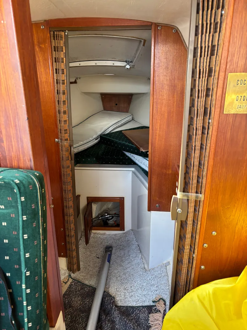 Slide: The Image of Interior of a 1986 Catalina 25 yacht with wood finish. - 49