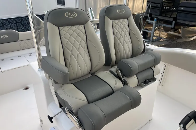 Slide: The Image of Luxury seating on 2026 Key West 263 FS boat, featuring premium gray upholstery. - 12