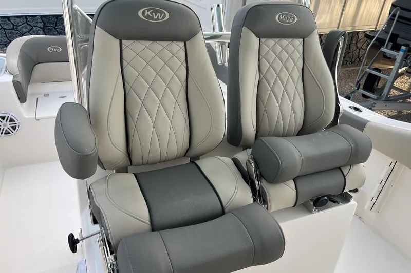 Slide: The Image of 2026 Key West 263 FS boat seats with elegant gray upholstery and armrests. - 13
