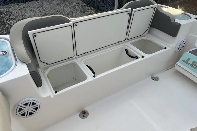 Slide: The Image of 2026 Key West 263 FS boat interior with storage compartments and seating. - 16