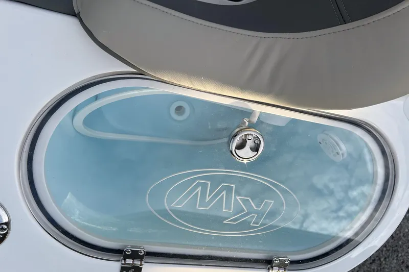Slide: The Image of 2026 Key West 263 FS boat livewell with KW logo and cushioned seat. - 17