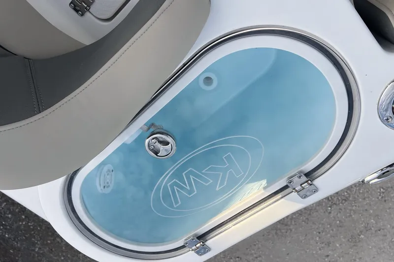 Slide: The Image of 2026 Key West 263 FS boat livewell with transparent lid and KW logo. - 18