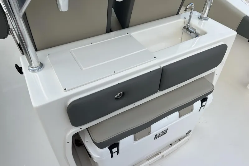 Slide: The Image of 2026 Key West 263 FS boat interior with sink and storage area. - 21