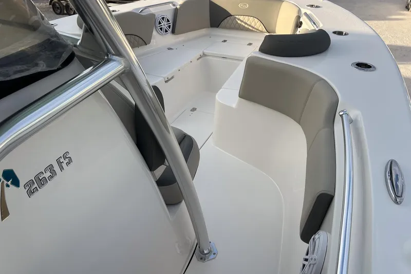 Slide: The Image of 2026 Key West 263 FS boat interior with seating and console details. - 22