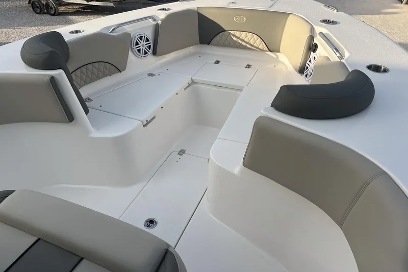 Slide: The Image of 2026 Key West 263 FS boat interior with cushioned seating and storage compartments. - 23