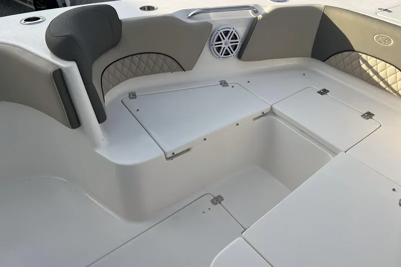 Slide: The Image of 2026 Key West 263 FS boat interior with cushioned seating and storage compartments. - 24