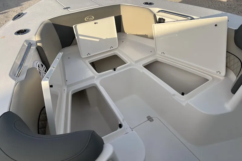 Slide: The Image of 2026 Key West 263 FS boat interior with open storage compartments. - 26