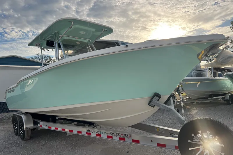 Slide: The Image of 2026 Key West 263 FS boat on trailer, under a cloudy sky. - 3