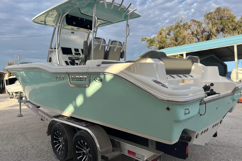 Slide: The Image of 2026 Key West 263 FS boat on trailer, light blue hull, parked outdoors. - 5