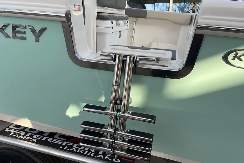 Slide: The Image of 2026 Key West 263 FS boat with foldable ladder and sleek design. - 6