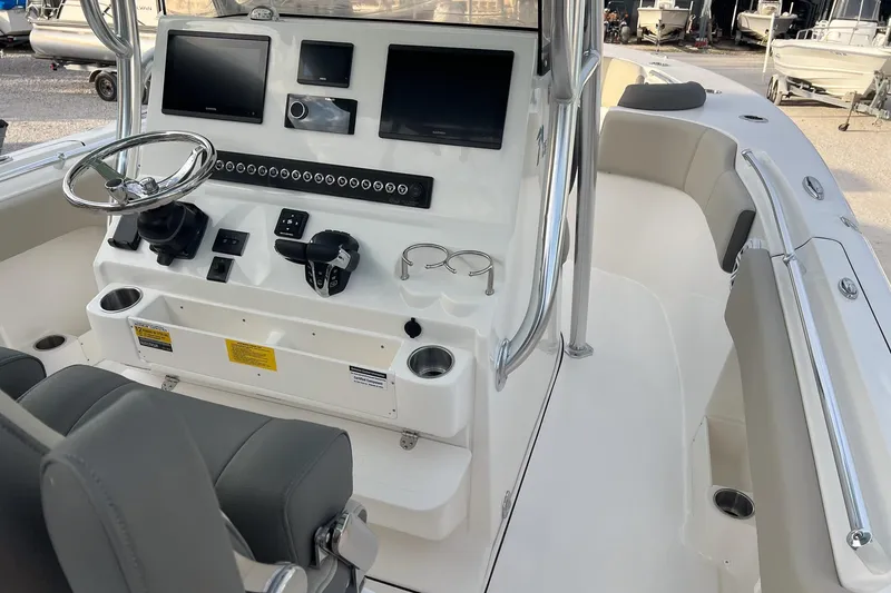 Slide: The Image of 2026 Key West 263 FS boat cockpit with modern controls and seating. - 8