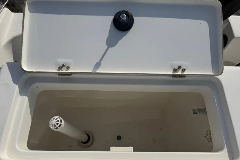 Slide: The Image of Open storage compartment on 2006 Mako 253 Walk Around boat. - 20