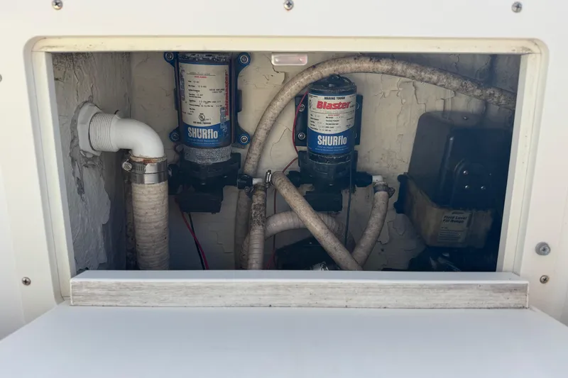 Slide: The Image of Boat plumbing system in a 2006 Mako 253 Walk Around, featuring Shurflo pumps. - 21