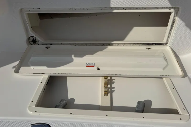 Slide: The Image of Open storage compartment on a 2006 Mako 253 Walk Around boat. - 39