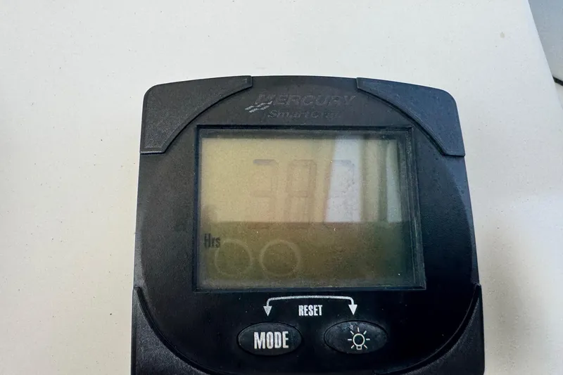 Slide: The Image of Mercury SmartCraft display on 2006 Mako 253 Walk Around boat dashboard. - 8