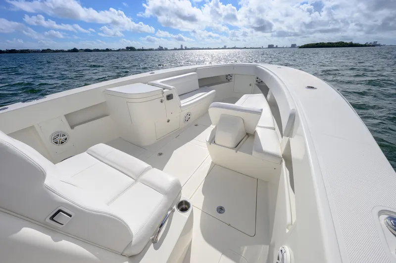 Slide: The Image of 2017 SeaVee 390Z boat with spacious white seating on open water. - 7