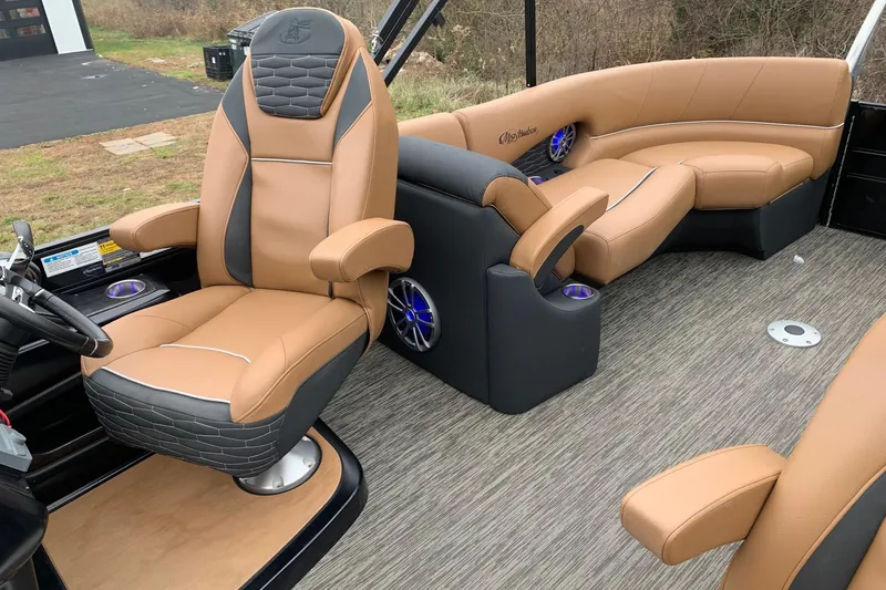 Slide: The Image of Luxurious interior of 2020 Misty Harbor Elite E3U pontoon boat with tan seating. - 10