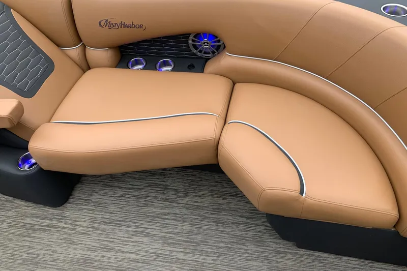 Slide: The Image of Luxurious tan seating on 2020 Misty Harbor Elite E3U boat with blue LED cup holders. - 12