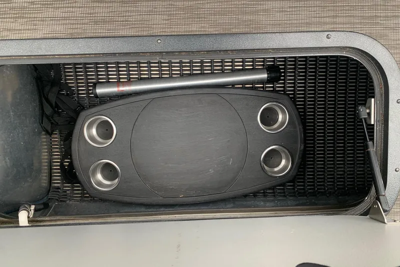 Slide: The Image of Storage compartment in 2020 Misty Harbor Elite E3U boat with table and accessories. - 22