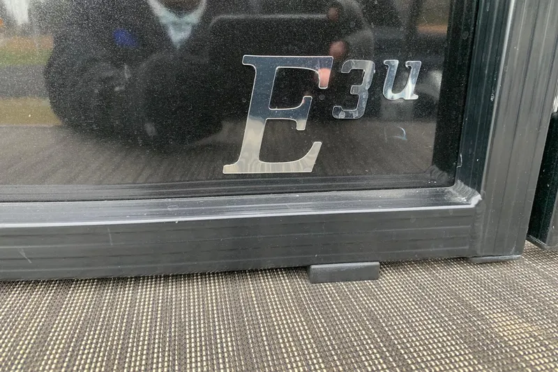 Slide: The Image of 2020 Misty Harbor Elite E3U logo on a reflective surface. - 4