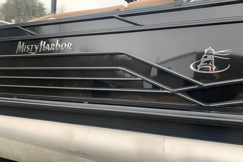 Slide: The Image of 2020 Misty Harbor Elite E3U pontoon boat with sleek black exterior design. - 5