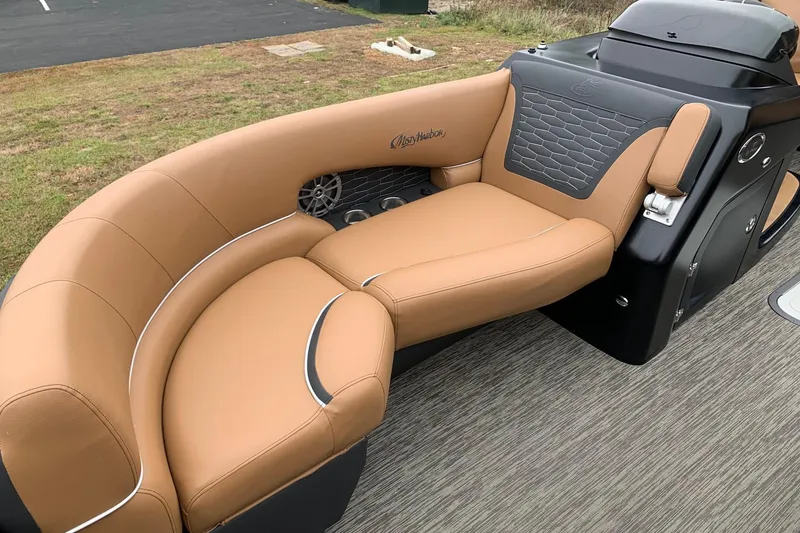 Slide: The Image of Luxurious tan seating on 2020 Misty Harbor Elite E3U boat, featuring sleek design and comfort. - 6