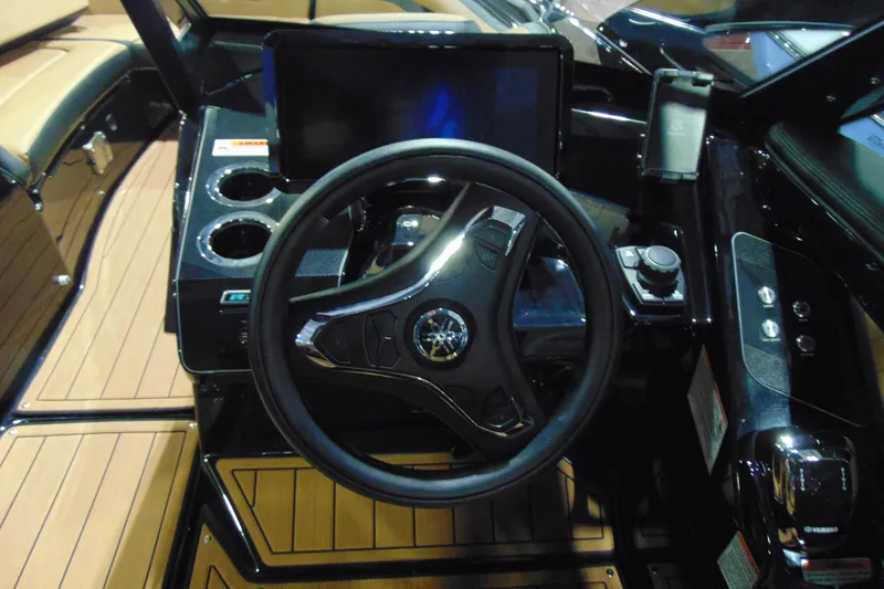 Slide: The Image of 2026 Yamaha Boats 275SD dashboard with steering wheel and modern controls. - 12