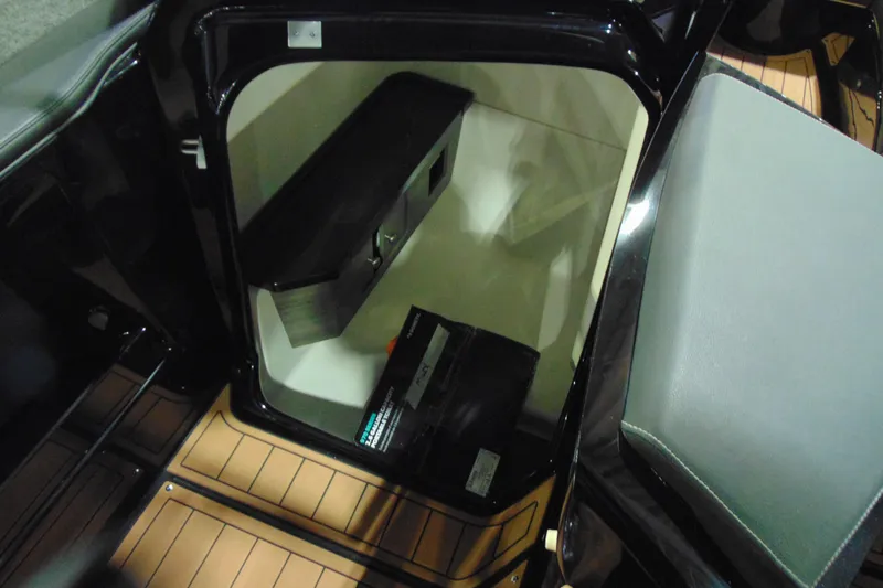 Slide: The Image of 2026 Yamaha Boats 275SD interior storage compartment with sleek design and modern features. - 13