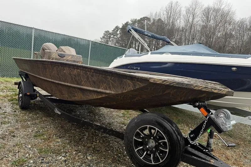 The Image of 2026 G3 Gator Tough 17 SC boat on trailer outdoors. - 1