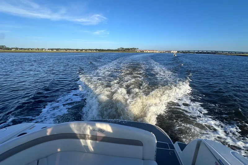 Slide: The Image of Luxurious interior of 2004 Sea Ray 320 Sundancer yacht with elegant seating and modern amenities. - 10