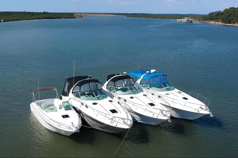 Slide: The Image of Luxurious interior of 2004 Sea Ray 320 Sundancer yacht with wood cabinetry and cozy seating. - 11