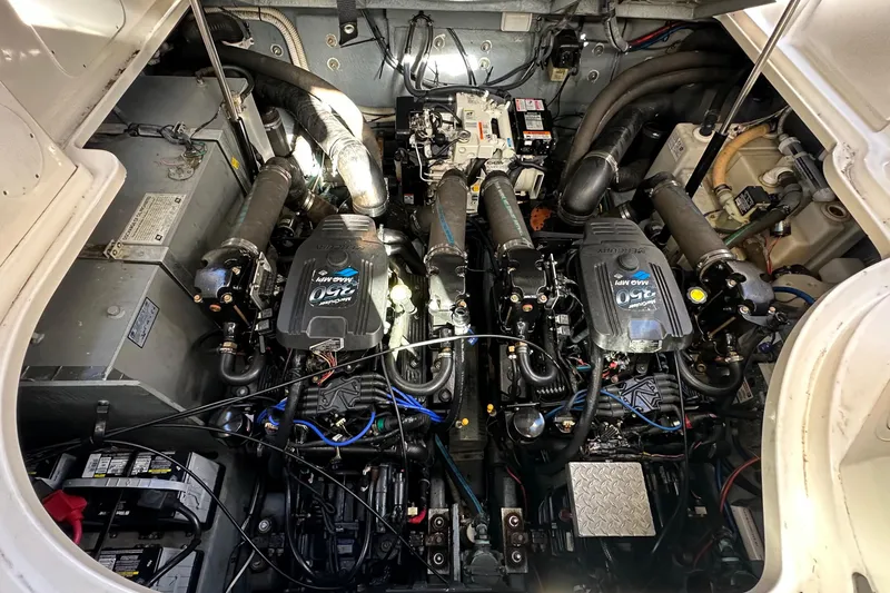 Slide: The Image of Engine compartment of a 2004 Sea Ray 320 Sundancer with twin Mercury engines. - 16