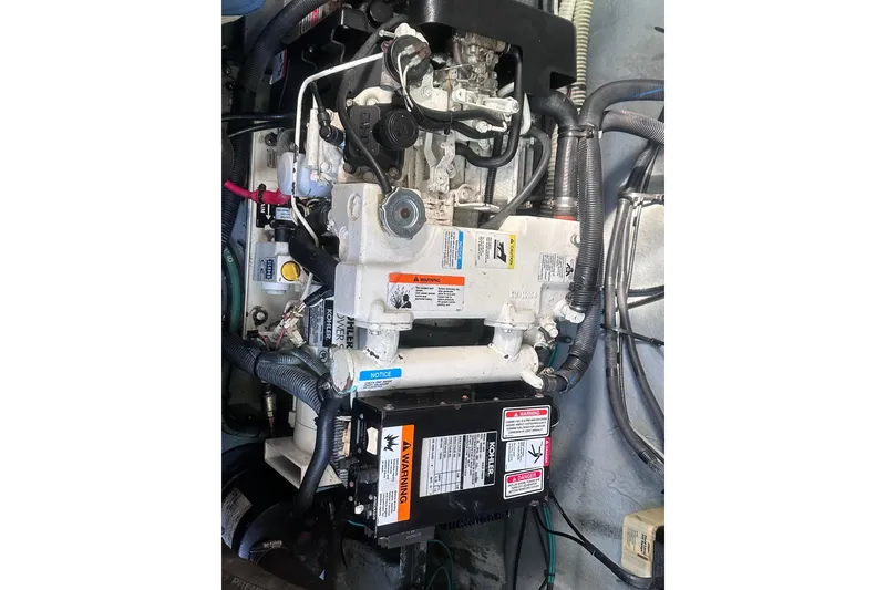Slide: The Image of Engine compartment of a 2004 Sea Ray 320 Sundancer boat. - 18