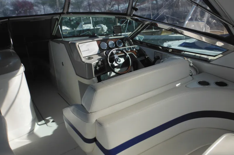 Slide: The Image of 2003 Formula 280 Bowrider interior with steering wheel, dashboard, and seating area. - 10