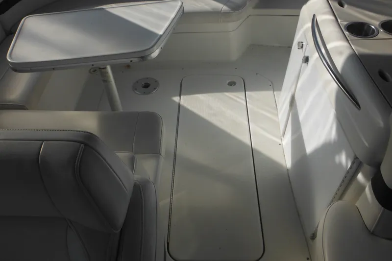 Slide: The Image of 2003 Formula 280 Bowrider interior with seating, table, and storage compartments. - 12