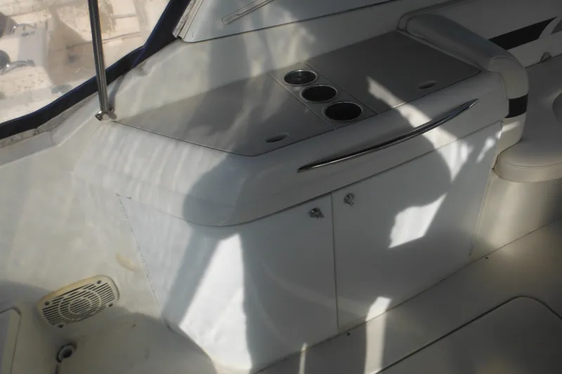 Slide: The Image of 2003 Formula 280 Bowrider interior with cup holders and storage cabinet. - 14