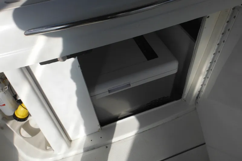Slide: The Image of Storage compartment on a 2003 Formula 280 Bowrider boat with cooler inside. - 15