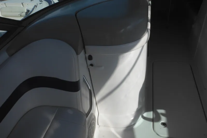 Slide: The Image of Interior view of a 2003 Formula 280 Bowrider boat, featuring seating and storage. - 23