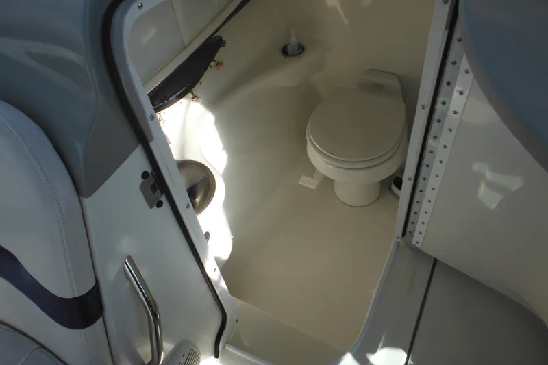 Slide: The Image of 2003 Formula 280 Bowrider boat interior with compact marine toilet. - 24
