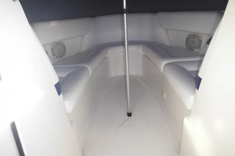 Slide: The Image of Interior of 2003 Formula 280 Bowrider boat with cushioned seating and speakers. - 28