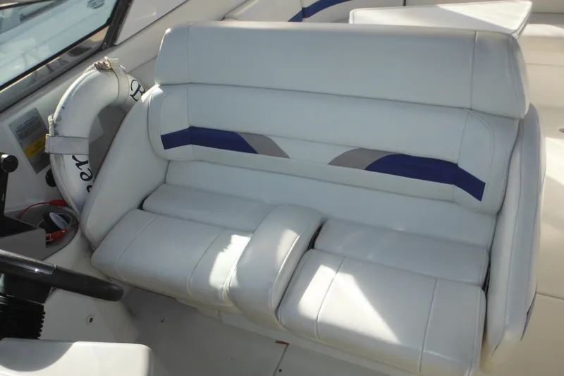 Slide: The Image of 2003 Formula 280 Bowrider interior with white leather seating and steering wheel. - 34